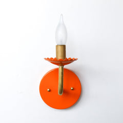 Orange and brass feminine colorful wall sconce with scalloped edge detailing.  Adds color and whimsey to any wall