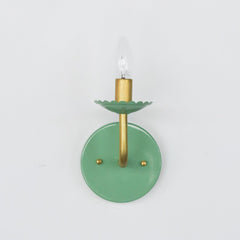 Pastel Green & Brass modern wall sconce with scalloped detail on the bobesche
