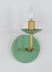 Pastel Green & Brass modern wall sconce with scalloped detail on the bobesche