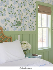 Modern vintage bedside wall sconce in vista green with chrome arm and round backplate, mounted above a blue nightstand with white bedding and woven rattan headboard, charming cottagecore bedroom wall lighting for a guest room, nursery, or traditional home, small scale wall sconce with exposed bulb and sleek chrome details for classic meets modern interiors