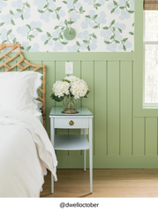 Adele wall sconce in vista green and chrome styled in a serene bedroom with green board and batten wainscoting and hydrangea floral wallpaper, timeless wall lighting fixture for bedside reading light, hallway lighting, powder room lighting, or guest bedroom, modern traditional sconce with exposed bulb and minimal profile, perfect for coastal, grandmillennial, and English cottage interiors