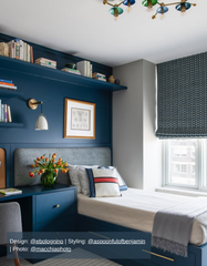 Playful mid-century modern ceiling light with a sculptural brass structure and colorful hand-blown glass discs in shades of green and cobalt blue. This semi-flushmount fixture adds vibrant personality and artistic flair to a stylish navy blue built-in bedroom with integrated shelving, a modern desk, and brass hardware. The colorful ceiling light is a standout centerpiece in this cozy, designer children's room, ideal for buyers looking for handcrafted lighting with retro charm and a pop of color.