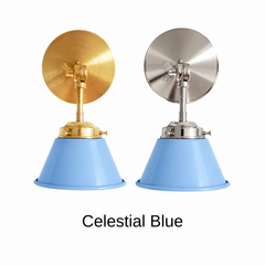 A sky blue wall sconce with a glossy cone shade, shown in Celestial Blue with brass or nickel hardware. It has a single light, a round backplate, and a swivel knuckle with a wing nut so you can tilt the shade toward a bed, a mirror, or a sink. Hang one in a nursery or kids room, a pair by a bathroom mirror as a vanity light, or one over a kitchen sink. Sky blue looks fresh with white walls, yellow or pink accents, and light wood, so it suits coastal, Scandinavian, and cheerful kids room decor.