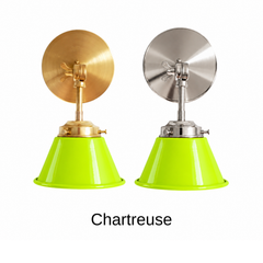 A chartreuse lime green wall sconce with a glossy cone shade, shown in Chartreuse with brass or nickel hardware. It has a single light, a round backplate, and a swivel knuckle with a wing nut so you can aim the shade where you need it. Hang one by a bed, a pair beside a bathroom mirror as a vanity light, or one over a kitchen sink. Chartreuse looks sharp with navy or plum walls, black and white tile, and pink accents, so it suits maximalist, Hollywood Regency, and eclectic rooms.