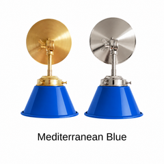 A cobalt blue wall sconce with a glossy cone shade, shown in Mediterranean Blue with brass or nickel hardware. It has a single light, a round backplate, and a swivel knuckle with a wing nut so you can aim the shade where you need it. Mount a pair by a bathroom mirror as a vanity light, one over a kitchen sink, or one by a bed for reading. Cobalt looks sharp with white plaster, patterned cement tile, and terracotta, so it suits Mediterranean, Spanish revival, and bold colorful kitchen decor.