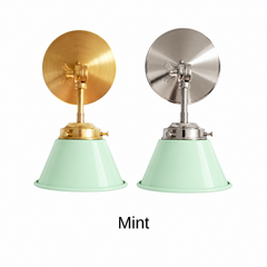 A pastel mint green wall sconce with a glossy cone shade, shown in Mint with brass or nickel hardware. It has a single light, a round backplate, and a swivel knuckle with a wing nut so you can tilt the shade toward a bed, a mirror, or a sink. Hang one in a nursery or bedroom, a pair beside a bathroom mirror as a vanity light, or one over a laundry room sink. Pale mint looks soft with white beadboard, pink or lilac accents, and light oak, so it suits pastel, cottage, and vintage bathroom decor.