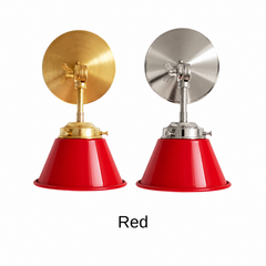 A bright red wall sconce with a glossy cone shade, shown in Red with brass or nickel hardware. It has a single light, a round backplate, and a swivel knuckle with a wing nut so you can aim the light where you need it. Put one over a kitchen sink or open shelving, a pair by a bathroom mirror as a vanity light, or one by a reading chair. Red looks sharp on white subway tile, navy walls, and checkerboard floors, so it suits retro kitchen, diner, and eclectic decor.