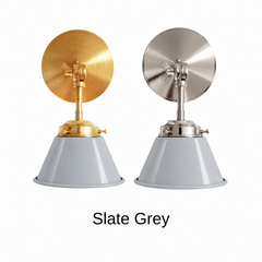 A light gray wall sconce with a glossy cone shade, shown in Slate Grey with brass or nickel hardware. It has a single light, a round backplate, and a swivel knuckle with a wing nut so you can tilt the shade toward a bed, a desk, or a mirror. Hang one by a bed, a pair by a bathroom mirror as a vanity light, or one over a kitchen sink. Soft gray pairs well with white oak, linen, and marble, and it gives colorful walls a quiet accent, so it suits Scandinavian, transitional, and minimalist rooms.