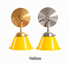 A bright yellow wall sconce with a glossy cone shade, shown in Yellow with brass or nickel hardware. It has a single light, a round backplate, and a swivel knuckle with a wing nut so you can aim the shade where you need it. Put one over a kitchen sink, a pair by a bathroom mirror as a vanity light, or one in a playroom or kids room. Sunny yellow looks great with blue and white tile, gray walls, and checkerboard floors, so it suits retro, Scandinavian, and cheerful cottage decor.