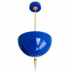 Handmade blue pendant light in a bold, glossy Mediterranean blue — a high-gloss powder-coated dome in vivid cobalt, lifted by a slim brass stem and a hand-turned brass finial. The color is saturated and jewel-like: it reads bright sapphire in daylight and deepens under lamplight, so it plays beautifully against warm brass, white walls, natural wood, or a tiled backsplash without ever feeling flat. Perfect over a kitchen island, a powder room, a sunroom, or an entryway that could use a punch of true blue. Sh