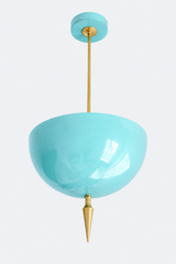 Poolside blue pendant light with a brass spike finial, the Alexander Pendant sends light up instead of down, so the glossy blue dome bounces a soft glow off the ceiling. That uplight pendant design paired with the oversized art deco spike gives it retro coastal charm with real architectural weight, like a vintage pool tile turned into a light fixture. Statement dining room pendant, sunroom ceiling light, or colorful entryway fixture for retro coastal homes and maximalist decor that wants personality overhea