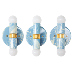 Three Hydrangea, Cream, and Gold hand-marbled Small Thalia Sconces shown together to highlight the natural variation in each small-batch finish. Every sconce has its own mix of soft blue, cream, white, and gold marbling, giving the fixture a handmade custom look while staying airy and easy to decorate with. A great choice for matching bathroom sconces, double vanity lighting, kids bathroom lighting, powder rooms, coastal homes, grandmillennial spaces, and colorful cottage interiors.