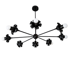 This isn’t a chandelier that blends in, and it’s not supposed to be. The Large Octavia in all black takes a sputnik’s scattered-arm energy and gives every bulb its own ruffled, flower-shaped bobeche, so instead of reading industrial it reads almost botanical, like something between a light fixture and a piece of sculpture. The scale alone makes it a real centerpiece over a dining table, a stairwell, or a double-height entry where a standard flush mount would disappear. All black means it can go moody tradit