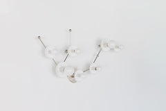 White Aquarius zodiac wall sconce in polished chrome with branching arms and white powder coated steel discs, a star sign light fixture with a clean modern look and geometric personality, ideal for contemporary bathrooms, mid century inspired spaces, and eclectic interiors.