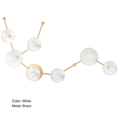 Horizontal view of the White Aquarius star sign wall sconce in brass with multiple white powder coated steel discs and globe bulbs, a constellation style astrology lighting fixture that works as a statement bathroom vanity light for maximalist design lovers and mid century modern decor.