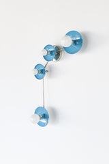 Aries zodiac wall sconce in Hydrangea Blue with polished chrome hardware, a modern constellation style light fixture with four round powder coated steel discs and opal globe bulbs on a slim curved arm, bold blue accent lighting for a contemporary bathroom vanity, hallway, bedroom, kids room, or maximalist interior design, playful modern wall lighting with a clean glossy pop of color and sculptural mid century inspired silhouette.