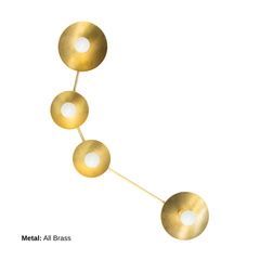 Aries zodiac constellation wall light in all brass metal with four round disc shades and white globe bulbs, sculptural star sign sconce with warm golden finish, modern mid century inspired statement lighting for entryway, hallway, living room, bedside reading light, or powder room, brass wall fixture for layered lighting, designer interior, artful minimalism, eclectic decor, and luxe bathroom vanity lighting