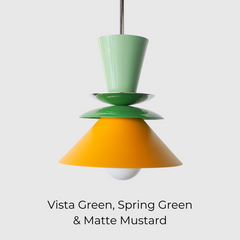 Colorblocked Astro Pendant light with a modern geometric silhouette, featuring powdercoated aluminum shades in Vista Green, Spring Green, and Matte Mustard. Topped with a brass accent and suspended from a brass rod. Handcrafted in New Orleans by Sazerac Stitches, this statement pendant is ideal for kitchens, dining rooms, or bold interior spaces with a playful or maximalist design aesthetic.