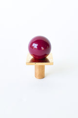 Glossy Black Cherry Square Gumball Knob with unlacquered brass base and square backplate. This rich, deep berry-toned drawer pull adds a luxurious pop of color to cabinets, dressers, or nightstands—perfect for bold kitchens, bathrooms, or kids’ rooms with maximalist or vintage style.
