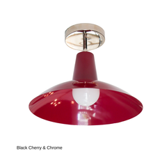 A black cherry flushmount with a cone-shaped neck opening into a shallow saucer shade, paired with cool chrome hardware instead of brass. The exposed bulb sits just below the shade's edge. A saturated, sculptural option for anyone wanting color with a cooler metal finish rather than warm brass.