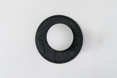 Matte black unglazed porcelain wall sconce with raised leafy relief and frosted glass globe, sculptural modern ceramic lighting