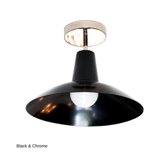 A black flushmount with a cone-shaped neck that opens into a shallow saucer shade, paired here with a cool chrome canopy and stem instead of brass. The exposed bulb sits just below the shade's edge. A sculptural option for hallways, entries, or low-ceiling rooms that want something more graphic than a standard flush mount.