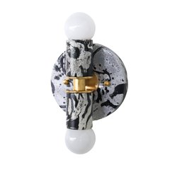 One-of-a-kind Sazerac Stitches Thalia sconce in a black, white, and gray marbled colorway, photographed close to show the glossy texture, organic swirls, and splattered details across the round backplate and socket. Brass accents keep it feeling elevated, not harsh. Ideal for searches like modern powder room lighting, monochrome decor inspiration, black and white bathroom sconces, art-inspired wall lighting, and statement sconces for small bathrooms, hallways, and reading nooks.