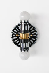 Handpainted black and white patterned wall sconce inspired by Greece & Portugal.  Maximalist style wall sconce that has a natural element because each one is hand-painted.  The painted thalia is a perfect small sconce that doubles as a statement light fixture because of the bold design.  Great for bathrooms, hallways, and more.   