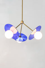 Handcrafted pendant light featuring intricate etched acrylic discs for a captivating lighting effect.