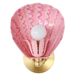 Front-facing view of the Coquille wall sconce in blush pink with raspberry squiggle pattern, hand-painted on powder-coated steel, featuring a fluted socket cup and solid brass hardware – whimsical pink shell light perfect for maximalist bathrooms, coastal-inspired kids’ rooms, or eclectic gallery walls