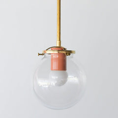 Brass and Glass kitchen or bathroom pendant light fixture with a pop of peach color