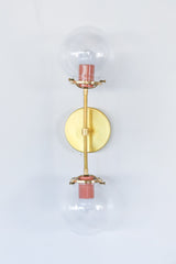 modern brass and peach wall sconce for bathrooms