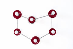 A Capricorn constellation wall sconce with six globe bulbs set in glossy garnet red disc shades, each one a star, linked by thin polished nickel rods that trace the sea goat sign. Garnet is the January birthstone, so the color fits the sign. Hang it over a bed, a desk, or a reading nook. Deep red and silver look sharp on white or charcoal walls and suit celestial decor, star sign wall art, and modern eclectic rooms, and it makes a great Capricorn gift.
