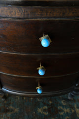 Celestial blue and brass square gumball drawer pulls installed on a vintage wood dresser. These pastel blue knobs add a charming pop of color and whimsy to bedroom furniture, bathroom cabinets, or nursery drawers. Handmade, colorful hardware for modern or eclectic interiors.