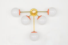 Peach and Brass Large Modern wall sconce with five lights. Eclectic modern with a nod to mid century style design