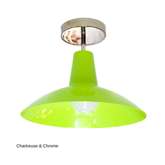 The Bruxelles Flushmount brings a bright, citrusy chartreuse to a fixture built for ceilings that can't fit a hanging pendant. The wide, angled shade and clean chrome hardware keep it feeling architectural rather than loud, making it a strong pick over a kitchen island, in an entryway, or lighting a hallway or laundry room where you still want real color overhead.
