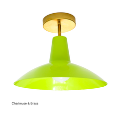 This version of the Bruxelles Flushmount pairs the same bright chartreuse shade with warm brass hardware instead of chrome, giving it a softer, more traditional feel. It solves the same low-ceiling problem with a design-forward shape, whether that's over a kitchen island, in an entryway, or lighting a hallway or laundry room.
