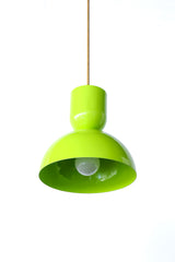 Chartreuse is the fearless color that makes a whole kitchen feel alive, and this Taeuber pendant leans right into it. The two-part silhouette stacks a rounded cup over a wide domed bell, all finished in a glossy chartreuse with a warm brass stem, shown here lit and glowing. It reads bold, a little unexpected, and very design-forward, the kind of statement lighting that turns an island, breakfast nook, or sink into a real focal point. Hang one as a jolt of color or a row for maximum impact. A great choice fo