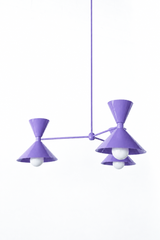 Bright lavender-purple is the color that makes a room feel joyful, unexpected, and a little bit magic, and this mid-century modern Clancy chandelier commits all the way, shades, arms, and stem in one glossy orchid. Three double-cone bowtie shades radiate from a central sphere hub in a fun, sculptural MCM silhouette, throwing light up and down from each arm. It's built to be the star over a dining table, a bedroom, a girl's room, or a playful entry, the kind of statement piece that makes people ask whose hou