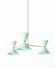 Soft and Pretty mid-century modern chandelier in mint and raw brass finish.  Features masculine oversize cone shades with a center brass part. Great colorful chandelier for kids playrooms, dining rooms, bedrooms, and moore. Height can be customized. Made by Sazerac Stiches in New Orleans