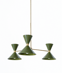 An earthy olive-green chandelier with backbone, made for a dining room, study, or bedroom that wants color without going sweet. The Clancy Chandelier has three arms, each ending in an oversized double-cone shade: a wide cone below that throws light down and a smaller upturned cone above, joined at a raw brass collar. The arms sit at staggered heights off a central brass hub for a relaxed, asymmetric look, and the drop stem can be customized to your ceiling. Deep olive reads grown-up and a little masculine, 