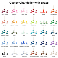 Every Clancy Chandelier color shown with warm raw brass hardware, 30 powder-coat shades on the same sculptural three-arm mid-century fixture. The range spans black cherry, doll pink, blush pink, red, flame, and orange peel, through peach, mustard, yellow, and chartreuse, into the full run of greens and blues (mermaid, olive, mint, poolside, teal, lagoon, denim, navy) plus orchid, black, white, slate grey, terra cotta, fudge brown, and cream. Brass warms up every shade and reads a little more classic than th