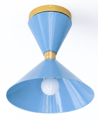 Pastel Blue and Brass flushmount ceiling light in a mid-century modern style light fixture. Great for small spaces, to bring in a little more color and design. We love this in a brightly colored bathroom, a pantry, a statement closet, an art room and more!