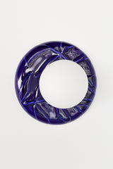 Close-up of cobalt blue Leafy Sconce showing sculptural leaf relief ceramic backplate and frosted glass globe shade, modern artisanal wall lighting detail.