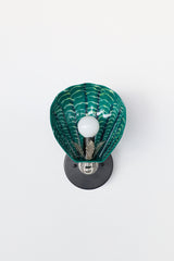 Modern Art Deco wall sconce with hand-painted green ceramic shell in a sea-inspired palette; mounted on matte black round backplate with vintage-style chrome detailing, custom one-of-a-kind light