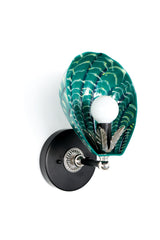 Front view of unique handmade shell sconce with glossy green hand-painted ceramic shade and subtle brushstroke detailing; mounted on black wall plate with silver hardware and leaf accent, sculptural light fixture by Sazerac Stitches