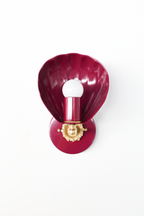 A scallop shell sconce in deep black cherry brings vintage-inspired drama to powder rooms, romantic bedrooms, and colorful bathrooms. The Coquille Sconce features a fluted shell shade in glossy burgundy powder coat, an ornate brass shell rosette, and an exposed globe bulb that glows against the saturated color. A statement-making choice for grandmillennial, coastal traditional, and collected homes that skip the beige. Available in 30+ powder coat colors.