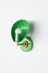 In Spring Green, the Coquille Sconce reads almost botanical, its fluted shell curving like a leaf around an exposed globe bulb. Glossy green powder coat covers the shade, arm, and round backplate, set off by a brass ball detail and cast brass rosette. A fresh, joyful choice for English cottage bathrooms, garden-inspired powder rooms, kids bathrooms, and colorful traditional homes that want green lighting with personality.