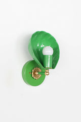 In Spring Green, the Coquille Sconce reads almost botanical, its fluted shell curving like a leaf around an exposed globe bulb. Glossy green powder coat covers the shade, arm, and round backplate, set off by a brass ball detail and cast brass rosette. A fresh, joyful choice for English cottage bathrooms, garden-inspired powder rooms, kids bathrooms, and colorful traditional homes that want green lighting with personality.