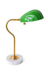 Coquille desk lamp in vibrant spring green with a brass curved arm and solid white marble base, featuring an Art Deco-inspired shell-shaped shade. Ideal for adding a pop of color and midcentury modern charm to desks, bedside tables, or reading nooks in coastal and eclectic decor styles.